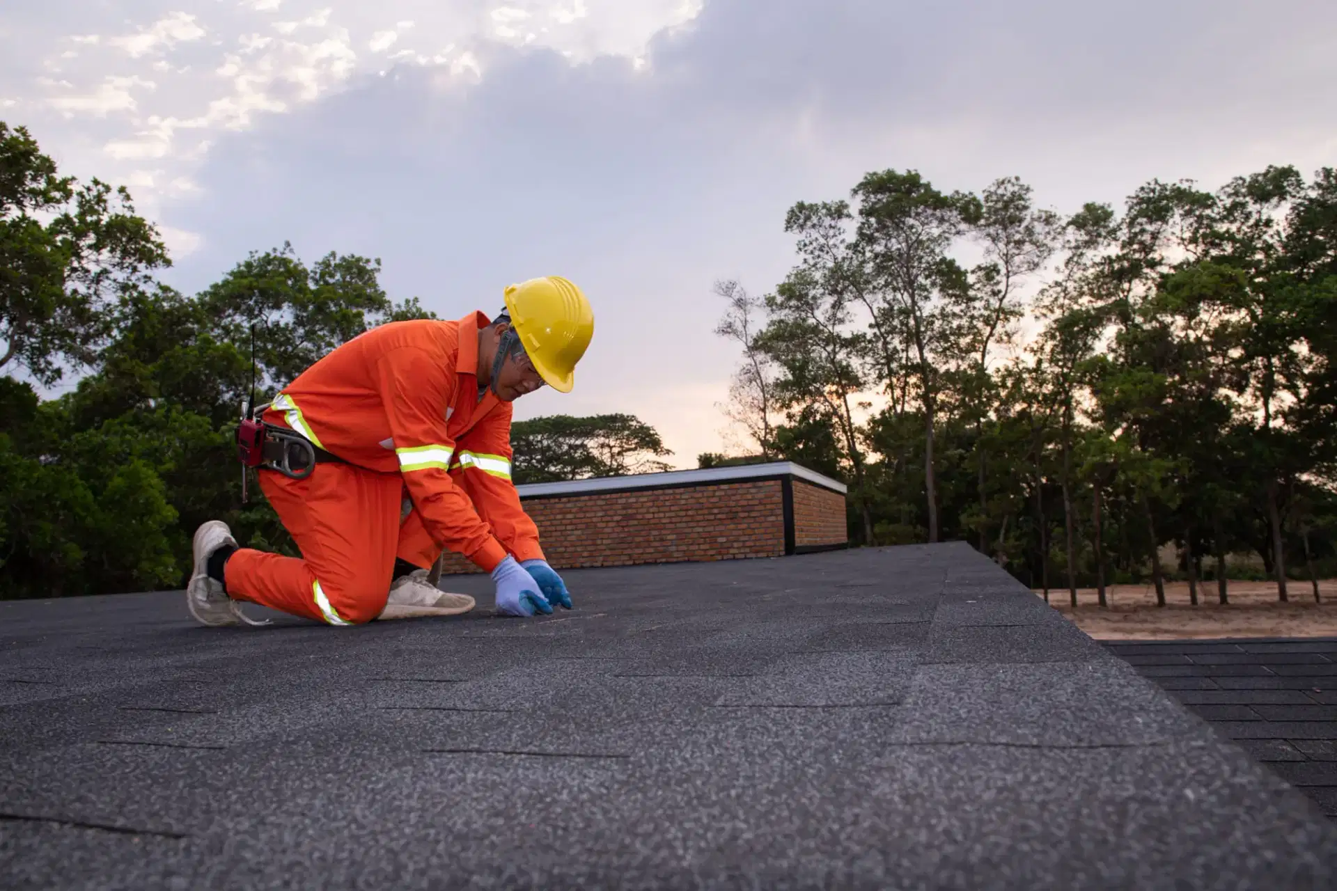 Tom Jannace roofer inspecting an asphalt shingle roof