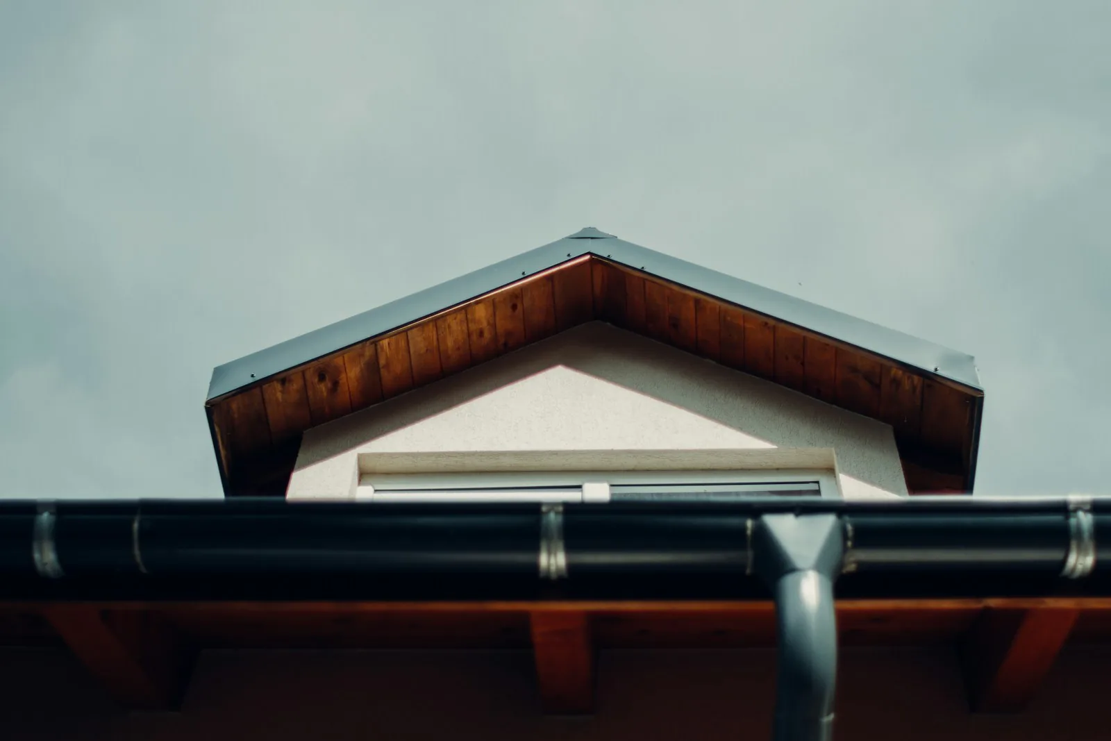 Sound fascia board and gutter along a clean residential roofline in Setauket, NY