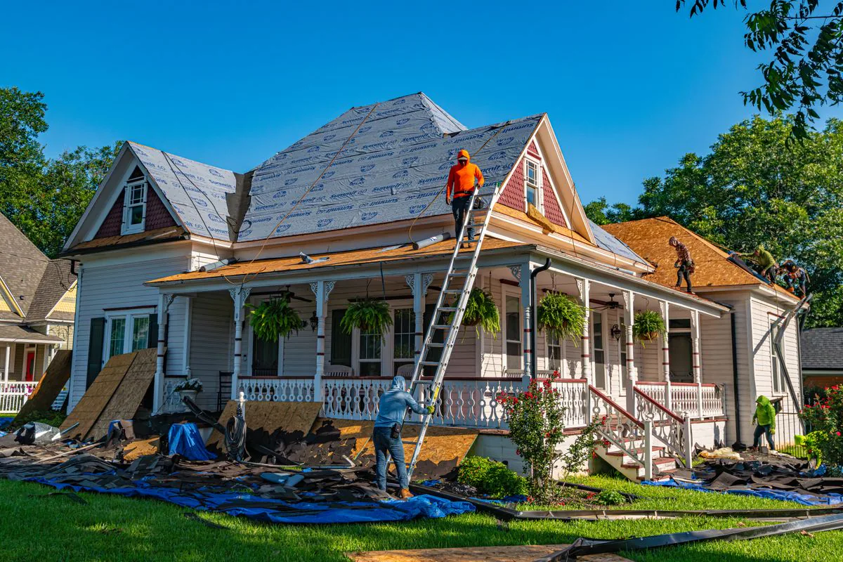 Professional roofing crew working on a residential roof replacement in Kings Park, Suffolk County