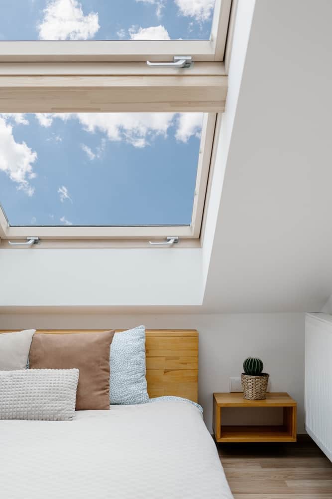 bedroom with skylight in ceiling